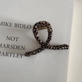 Detail view of leopard print fabric wrapped hair claw with gold metal spring components - Small Apricot Leopard Print