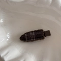 Detailed close-up of retro plaid fabric hair clip with elegant wavy jagged edges - Seamless Wave Plaid Style / Coffee