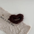 Detail of a brown fuzzy heart-shaped hair clip on artisanal paper with a cozy autumn vibe - Dark Coffee