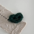 Macro detail of a dark green wool heart-shaped hair clip with soft fuzzy texture - Dark Green