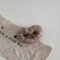 Close-up of brown knit heart hair clip with cozy wool texture and metal clip detail - Light Coffee