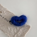 Macro detail of plush deep blue heart hair clip with soft texture on handmade paper - Dark Blue