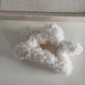 Close-up of white plush star-shaped hair claw clip made of soft faux lamb wool material - Plush Star-White