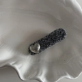 Detailed macro view of charcoal grey tweed hair clip with a vintage matte silver heart accent - Hammered Silver Heart Silver Gray Short Duckbill Clip