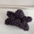 Close-up of a soft grey plush star-shaped hair claw with fuzzy faux shearling texture - Plush Star-Dark Brown