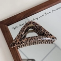 Detailed macro view of large leopard print hair claw clip with golden metal spring - Triangle (Coffee Leopard Print Hair Claw)