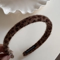 Close-up of leopard print faux fur headband with a handmade label on the inner side - Leopard Print Narrow Headband