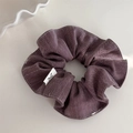 Detailed view of dark purple herringbone scrunchie with minimalist logo tag - Bean Paste Purple