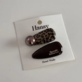 Detail of leopard print hair clip set with champagne pearls on a branded display card - Leopard Coffee Waterdrop