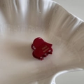 Detail of a deep red mini hair claw clip featuring golden FRANCE Handmade lettering - Dark Red