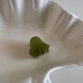 Close-up of heart-shaped olive green acetate hair claw clip with handmade engraving - Olive Green