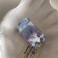 Detail showing marble pattern acetate hair claw clip with Barrette by France text - High Narrow Acetate Claw - Blue Purple