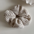 Detail view of cream knit scrunchie with soft textured yarn and colorful flecks - Knitted Scrunchie / Beige