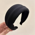 Dettaglio di un cerchietto in spugna nera spessa con maglia fine per uno stile retrò - Nero