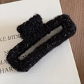 Detail of black plush hair claw clip featuring shimmering silver glitter thread texture - Rectangle (Black with Tinsel)