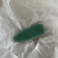 Detailed close-up of dark green matte hair clip with golden Barrette de France text - Green
