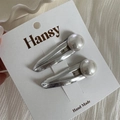 Detail of silver textured bow hair clips with white faux pearls on display card - Silver Leather Pearl Hair Clip