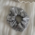 Detail of silver metallic scrunchie with three string bows and laser glitter texture - Silver Scrunchie - Silver Bow