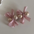 Detailed view of pink ribbon bows and faux pearls on a silver metal duckbill hair clip - Girl Pink Round