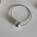 Minimalist silver elastic hair tie with a large metallic spherical bead for ponytails - Silver