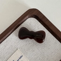 Detail einer dunkelbraunen Acetat-Schleife mit goldener France Handmade Aufschrift - Dunkelkaffee