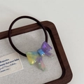 Macro detail of a gradient resin bow hair tie with polished handmade gold lettering - Bowknot Hair Tie-Iridescent Purple