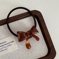 Detail of tortoise shell acetate bow hair tie on wooden tray with handmade engraving - Bowknot Hair Tie-Coffee