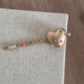 Close-up of golden heart hairpin with colorful polka dots on rustic linen surface - Heart Matte Gold Bobby Pin