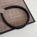 Detail of a vintage black polka dot headband on a rustic woven tray for hair styling - Narrow Polka Dot Headband - Black