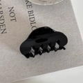 Close-up of a large glossy black French hair claw clip on neutral linen fabric texture - Small / Black Small