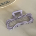 Close-up of lilac wave claw clip with stitched line details and matte resin finish - Purple (Dopamine Rectangle)