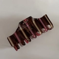 Detail of acetate hair claw with brown stripes and gold France Handmade lettering - Brown and Pink Stripes