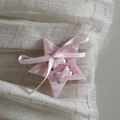 Macro detail of cream star hair clip with marble resin texture and pink silk ribbon bow - Pink Star