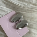 Polished silver oval earrings shown on a lavender display card with fabric background - Silver Solid Water Drop