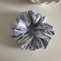 Detail of blue and white striped fabric scrunchie with a Made in Korea tag - Sea Salt Series Striped - Blue White