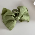 Detail view of large green fabric bow hair claw clip showing textile texture and metal spring - Bow Claw Clip / Green