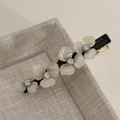 Macro shot of acetate floral hair clip with crystal centers and metal hardware - Acetate Rhinestone Flower Hair Clip / Beige