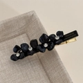 Detail of golden metal hair clip with France Handmade engraving and black acrylic petals - Acetate Rhinestone Flower Hair Clip / Blue and Purple