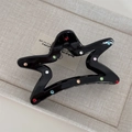 Close-up of star-shaped black hair claw clip decorated with colorful rhinestones - Black Star with Colorful Rhinestones