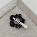 Detailed view of flower-shaped hair clip with black and white polka dots and metal duckbill clip - Black Polka Dot - Seamless Flower