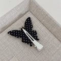 Detail view of the metal duckbill clip back on a retro butterfly hair hairpin - Black Polka Dot - Seamless Butterfly