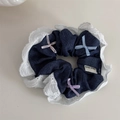 Close-up of denim scrunchie with white lace trim and three colorful ribbon bows - Dark Blue (Deep Scrunchie)