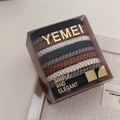 Detail of 10pcs high-elastic woven hair ties in earth tones with simple elegant packaging - Black Apricot Coffee