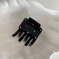 Dettaglio molletta per capelli in acetato nero con strass colorati su vassoio bianco - Piccolo Nero con Strass Colorati