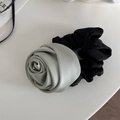 Detail view of a dual-tone hair scrunchie with a grey silk-texture handmade rose bloom - Mint Green Rose - Scrunchie