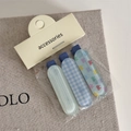 Detailed view of three blue checkered and striped hair clips on accessory card - Bobby Pin / Blue