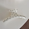 Macro view of cream large hair claw clip with black polka dots and smooth resin finish - White Polka Dot - Straight