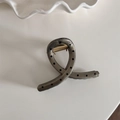 Detail of translucent grey hair claw clip with black polka dots and gold metal spring - Coffee Polka Dot - Cross