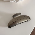 Detailed macro view of a grey metallic hair claw clip with black polka dot patterns - Coffee Polka Dot - Large Fan