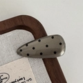 Detailed view of a vintage polka dot hair clip on a textured linen background - Water Drop Hair Clip / Rose Gold